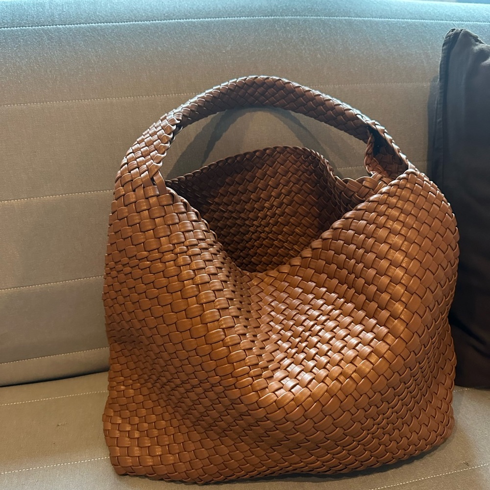 Vegan leather woven handbag.